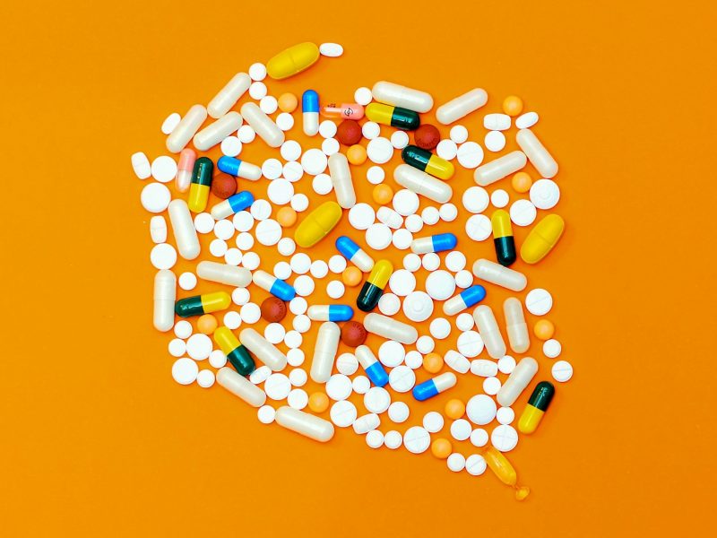 white and orange medication pill